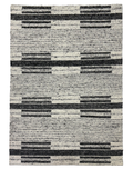 A modern striped carpet in charcoal and ivory, featuring a flat weave with a wool and cotton blend, perfect for contemporary interiors.