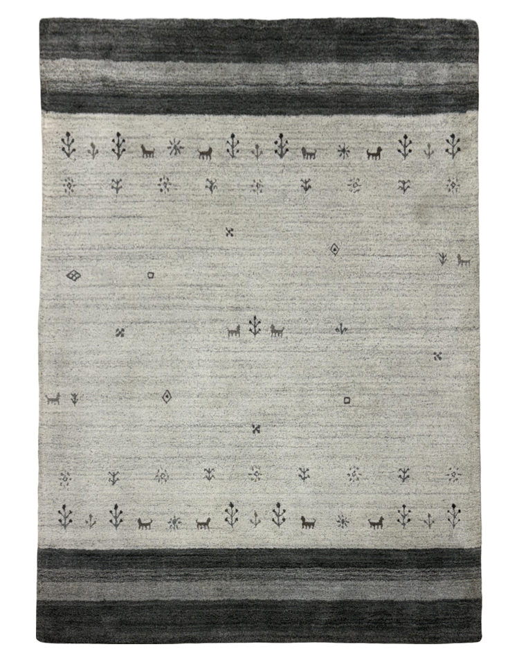 A luxurious transitional grey carpet with textured solid pattern, made from wool and tencel, perfect for modern spaces.