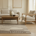 A luxurious brown and ivory modern geometric wool carpet laid on a marble floor, showcasing a sophisticated design.
