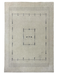 Beige loom-knotted rug with a geometric pattern and charcoal accents, ideal for elegant home interiors.
