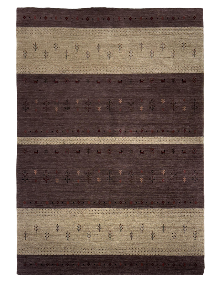 Loom knotted brown carpet with stripe pattern in brown, mocha, and camel colors placed on a marbled floor.
