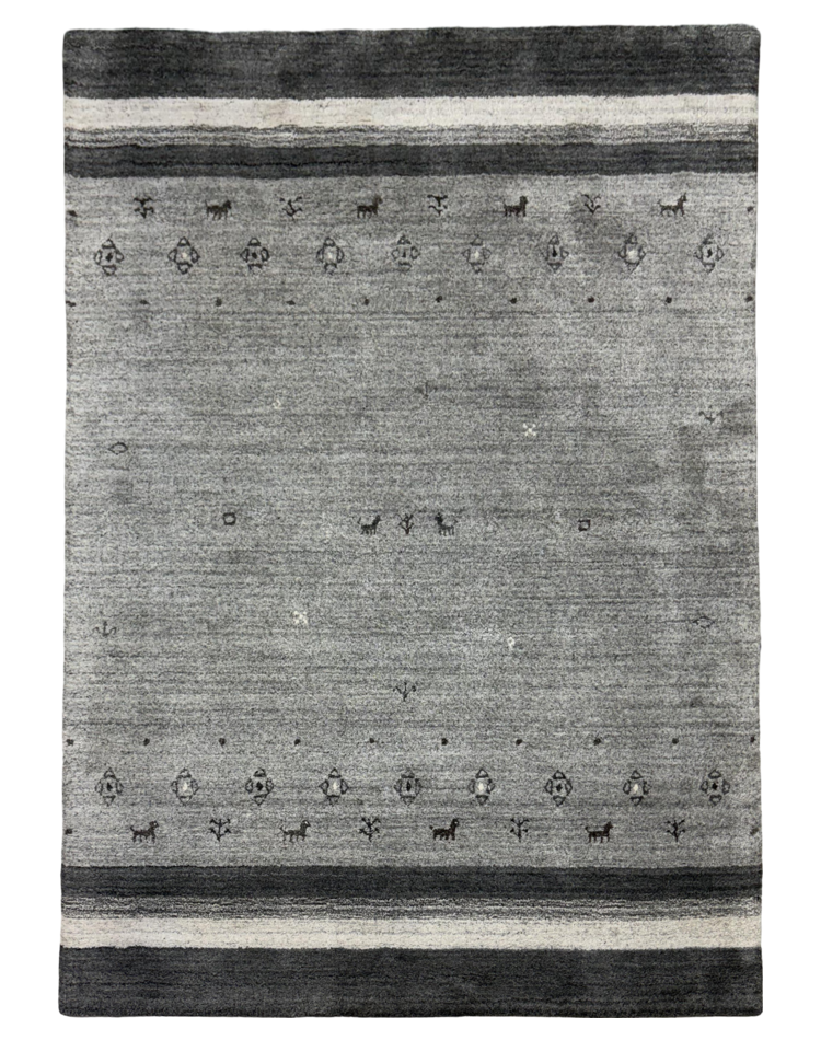 Luxurious modern carpet in gray tones with a textured solid pattern, crafted from a wool blend, ideal for contemporary homes.