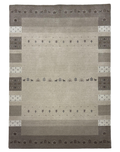 Transitional camel-colored carpet with border design, crafted from wool and cotton blend, displayed on a marble floor.