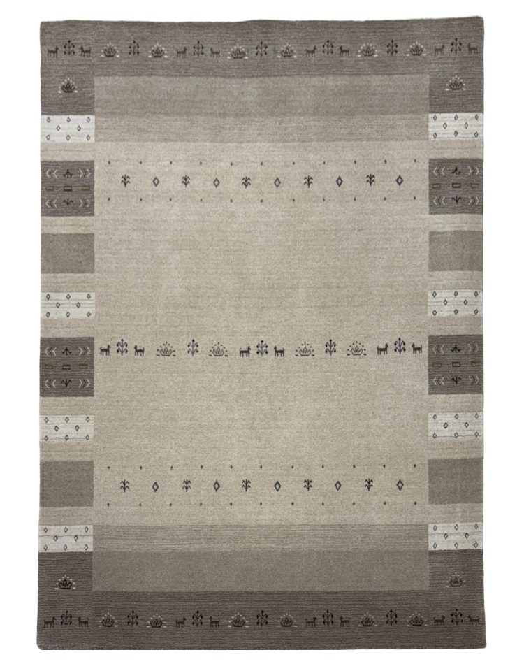 Transitional camel-colored carpet with border design, crafted from wool and cotton blend, displayed on a marble floor.
